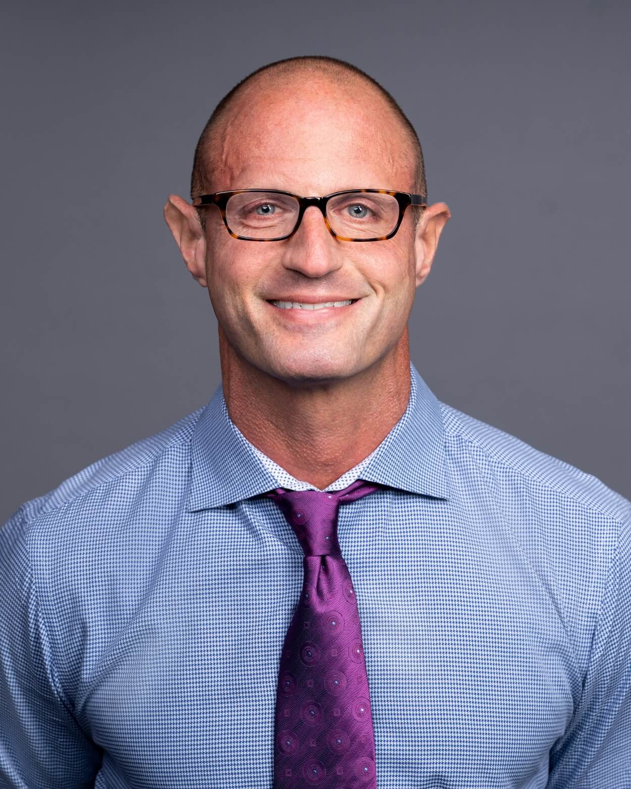 creative branding photography for startup executive creative branding shot of executive with purple tie