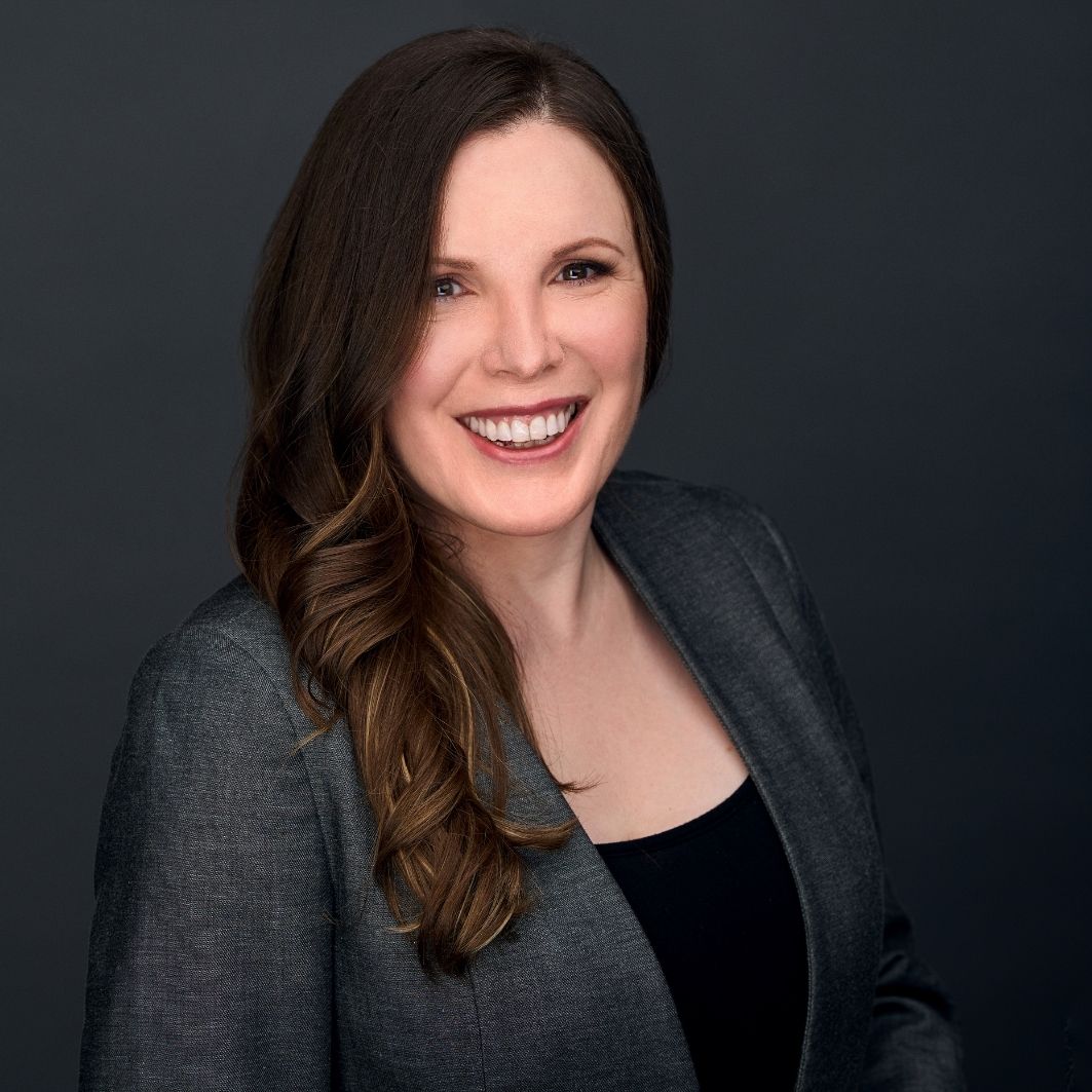 professional headshot on charcoal background